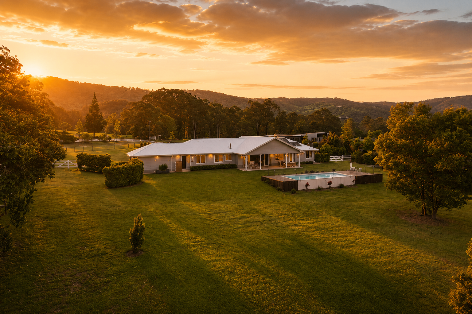 Aerial view of the Camp Mountain property at sunset